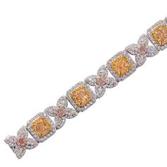 A beautiful tennis bracelet showcasing 10.81 carats of fancy yellow diamonds, 8.28 carats of white diamonds, and 0.35 carats of fancy pink diamonds, set in 18 karat two tone gold. Yellow Diamond Bracelet, Diamonds Direct, Alexis Bittar Jewelry, Diamond Mines, Pink Diamonds, Yellow Diamonds, Fancy Yellow Diamond, Expensive Jewelry, Alexis Bittar