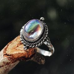 Stand out from the crowd with our boho chic iridescent mystic opal sterling silver ring. Our Little Luna is a beautiful ring with delicate detailing featuring an enchanting witchy mystic stone centre. A Shop Dixi classic to enhance your bohemian jewellery collection. MaterialSterling SilverSynthetic Mystic Opal SizingRing Front - Height 18mm Pumpkin Ring, Gothic Ring, Bohemian Jewellery, Gothic Rings, Jewelry Website, Bohemian Rings, Hippie Jewelry, Boho Ring, Vintage Jewels