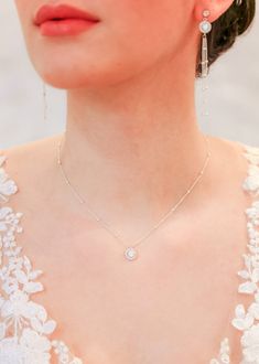 "Elegant bridal necklace with a round crystal pendant on a delicate sterling silver chain. To be worn with matching Joséphine earrings, bracelet and backdrop.   - Length: 41cm (16\") + 4 cm (1.5\") extension chain - Length of pendant: 1cm (0.40\") - Sterling silver chain and clasp If you require a special size, please contact me. We accept returns and exchanges even for special sizes. ♥ Joséphine collection https://www.etsy.com/fr/shop/Princessed1jour?ref=l2-shopheader-name&search_query=josephine ♥ All bridal necklaces https://www.etsy.com/fr/shop/Princessed1jour?section_id=23004653 ♥ My shop https://www.etsy.com/fr/shop/Princessed1jour" Dazzling Silver Solitaire Necklace With Halo Design, Silver Sterling Solitaire Necklace With Halo Design, Silver Solitaire Necklace With Halo Design In Sterling Silver, White Solitaire Necklace With Halo Design In Sterling Silver, White Sterling Silver Solitaire Necklace With Halo Design, Silver Halo Solitaire Necklace For Wedding, Silver Solitaire Halo Necklace For Wedding, Dazzling Delicate Chain Necklace For Wedding, Dazzling Wedding Necklace With Delicate Chain