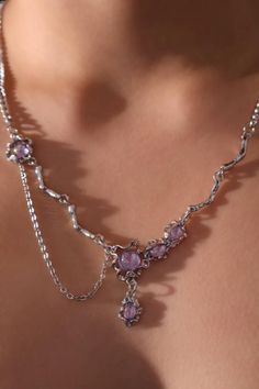 Discover the elegance of the Platinum Plated Purple Glitter Gem Dangle Necklace. This layered necklace boasts shimmering purple gemstones, intricate butterfly motifs, and sparkling crystals, offering a perfect blend of sophistication and fantasy for any occasion. Ideal for special events or as a statement piece, this necklace adds a magical touch to your style. Gold And Purple Necklace, Purple Gemstones, Lavender Necklace, Necklaces Crystal, Gold And Purple, Dangle Necklace, Purple Necklace, Dangle Necklaces, Pink Lavender