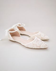 Crochet lace pointy toe flats for comfortable wear throughout your special day and perfect for wedding party. With pearl ankle strap to create a classic yet sophisticated look for any occasion. DETAILS: UPPER: Synthetic upper and lining MATERIALS: Manmade outsole HEEL HEIGHT: 0.3" ORIGIN: Imported Spring Wedding Pointed Toe Flats, Spring Wedding Ballet Flats With Ankle Strap, Lace Flat Heel Wedding Shoes For Spring, Spring Lace Flat Heel Wedding Shoes, Low Heel Wedding Flats For Spring, Lace Wedding Shoes With Flat Heel For Spring, Spring Wedding Flats With Flat Heel, Spring Wedding Flats With Low Heel, Summer Wedding Flats With Ankle Strap