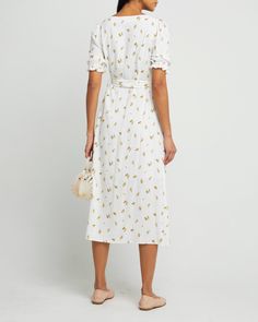 Price Comparison Few Moda $64 Reformation $265 Anthropologie $170 Product Details Light and breezy, this white floral dress is a breath of fresh air. Done with a button up front and adjustable waist tie create an easy fit.- Button up- Adjustable waist tie- Lined- Content: 100% Rayon Style# T22WDR12085 Fit Notes - Model wearing a size XS- Model measurements: 5'9'' Height / 32'' Bust / 25'' Waist / 35'' Hips A Breath Of Fresh Air, Bra Size Charts, White Floral Dress, Breath Of Fresh Air, Price Comparison, Active Wear Tops, Fresh Air, Waist Tie, Bra Sizes