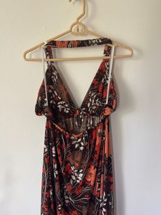 floor length maxi- beautiful poppy print - orange white and brown earth tones- empire waisted- lined cups- halter top- keyhole opening in frontsize Ljudging from the tag I'd say this is a 1990's style Brown Halter Neck Dress For Spring, Brown Halter Neck Dress For Summer, Brown Halter Neck Top For Vacation, Spring Brown Halter Neck Maxi Dress, Brown Halter Neck Sundress Maxi Dress, Brown Halter Neck Maxi Sundress, Orange Floral Print Halter Neck Maxi Dress, Orange Patchwork Maxi Dress, Mens Sweat Suits