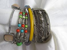 Four random bracelets, they are all in the boho style. Bohemian Bangle Friendship Bracelets, Bohemian Stackable Festival Bracelets, Bohemian Stackable Bracelets For Festival, Bohemian Stackable Friendship Bracelets For Festivals, Bohemian Stackable Bangle Cuff Bracelet, Handmade Bohemian Bracelets For Accessorizing, Bohemian Multicolor Stackable Friendship Bracelets, Bohemian Beaded Bangle Bracelets, Bohemian Assorted Bracelets