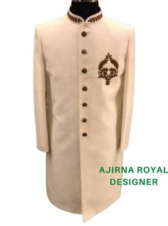 Make a grand entrance in this premium quality silk embroidery sherwani. Handcrafted to perfection, this luxury ethnic wear is the perfect addition to your wardrobe for any formal or festive occasion. The intricate embroidery on the sherwani adds a touch of elegance and sophistication to your look. This designer sherwani is made from the finest silk fabric, ensuring utmost comfort and durability. It features a traditional Indian design, making it perfect for weddings, parties, and other special occasions. The premium quality and attention to detail make this sherwani an excellent choice for grooms who want to make a statement on their big day. Pair it with your favorite traditional accessories for a complete look. Invest in this timeless piece of men's fashion and add it to your collection Elegant Raw Silk Sherwani With Intricate Embroidery, Elegant Embroidered Raw Silk Bandhgala, Elegant Embroidered Sherwani For Eid, Elegant Embroidered Designer Nehru Jacket, Elegant Embroidered Nehru Jacket For Designer Wear, Elegant Designer Embroidered Sherwani, Elegant Embroidered Sherwani For Designer Wear, Elegant Embroidered Sherwani For Festivals, Elegant Embroidered Designer Sherwani