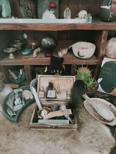 an open box sitting on top of a fur covered floor next to shelves filled with items