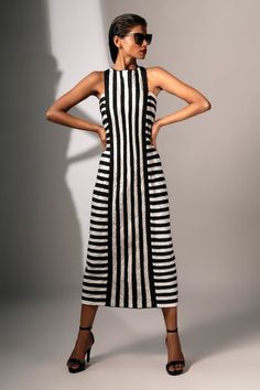 Black and white dress with stripped pattern. - Aza Fashions Striped Maxi Dress For Summer Evenings, Striped Sleeveless Midi Dress For Party, Sleeveless Striped Midi Dress For Party, Fitted Midi Dress With Vertical Stripes For Summer, Striped Midi Dress For Evening, White Midi Dress With Vertical Stripes For Summer, Chic Fitted Dress With Contrast Stripes, Chic Spring Dresses With Contrast Stripes, Striped Sleeveless Fitted Maxi Dress