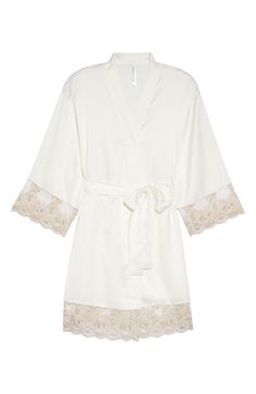 A lustrous satin robe edged with sheer floral lace is sure to make your mornings and evenings a little bit sweeter. 35 1/2" length (size Medium) Shawl collar Three-quarter sleeves Removable tie belt 100% polyester Hand wash, dry flat Imported Elegant Lace Robe With Lace Cuffs, Cream Lace Trim Wedding Robe, Feminine Fitted Robe With Lace Trim, Elegant Fitted Cream Robe, Fitted Feminine Robe With Lace Trim, Fitted Satin Robe With Lace Trim, Chic White Wedding Robe, Elegant Summer Lace Robe, Elegant Cream Robe For Daywear