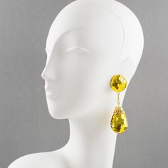 This is part of Chairish’s Costume Jewelry assortment.  Funky disco chandelier clip-on earrings with a vintage look. They feature a dangling design covered with bright yellow glitter sequins in a large teardrop ball charm shape. There is no visible maker's mark. Measurements: 3.57 in long (9 cm) x 1 in wide (2.6 cm).  Please see the measurements noted above in the description for the best approximate dimensions. Party Clip-on Drop Jewelry, Yellow Drop Clip-on Earrings For Party, Gold Teardrop Clip-on Earrings For Party, Gold Teardrop Chandelier Clip-on Earrings, Gold Teardrop Clip-on Chandelier Earrings, Clip-on Teardrop Earrings For Party, Glamorous Gold Clip-on Earrings For Party, Gold Teardrop Earrings For Party, Glamorous Gold Teardrop Earrings For Party