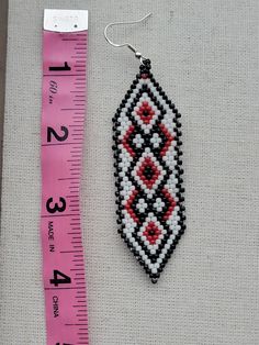 Traditional Red Earrings With Black Beads, Artisan Red Jewelry With Black Beads, Red Southwestern Style Earrings With Round Beads, Southwestern Red Beaded Earrings As Gift, Southwestern Black Beaded Earrings For Gift, Southwestern Style Red Round Bead Earrings, Southwestern Style Red Beaded Earrings As Gift, Southwestern Style Red Beaded Earrings For Gift, Fringe Earrings