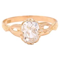 an antique diamond engagement ring in yellow gold