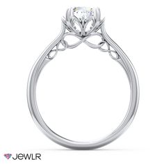 a white gold engagement ring with an intricate design