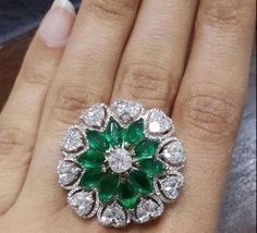 Specification:- *Diamond Type : Cubic Zirconia (CZ) *       Diamond Shape : Round, Marquise, Heart Cut *Total Diamond Weight : 7.12CT (Approx.) *Center Diamond Measurement : 7*3.50 MM *Center Diamond Weight : 3.50CT *Side Diamond Measurement : 1.10, 1.70, 2.10, 4.00MM  *Side Diamond Weight : 3.62CT *Diamond Color : White, Green *Diamond Clarity : VVS *Making Process: Handmade by our Experienced Staff. *Stamp: Our All Rings Stamped According to metal Purity (925 SIL/10K/14K/18K). Customization:- *Buyer can Request change of rhodium color in 925 Silver Jewelry (No additional Charge). *In Gold (10K, 14K, 18K) buyer can change gold color (White, Rose, Yellow). *Buyer can also change CZ Stone Color (No additional Charge). Custom Order:- *We do Accept Custom order. *Buyer can also request custom Marquise Wedding Ring, Hand Ring, Emerald Jewelry, 925 Silver Jewelry, Diamond Jewellery, Schmuck Design, Bridal Rings, Cocktail Ring, Luxury Jewelry