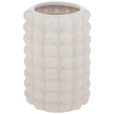 a white vase is shown on a white background and it has many balls all over the surface