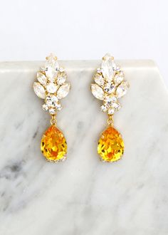 "Yellow Chandelier Earrings, Yellow Topaz Drop Earrings, Yellow Bridal Drop Earrings, Bridal Chandelier Earrings, Yellow Crystal Earrings MATCHING BRACELET: https://etsy.me/36b9gbO Add a sophisticated, stylish glow to any outfit with these beautiful lightweight Swarovski crystal chandeliers. Details: ♥ U.S packages shipped via USPS® insured+USPS® tracking number ♥ 1-year guarantee ♥ Materials- 14k Gold or Silver Plated over brass CRYSTALLIZED™ Swarovski Element ♥ Posts on top ♥ Size approx (54mm Luxury Yellow Gold Bollywood Earrings, Yellow Dangle Chandelier Earrings For Wedding, Yellow Teardrop Earrings For Wedding, Yellow Dangle Earrings For Wedding, Panama Wedding, Bridal Chandelier Earrings, Yellow Chandelier, Bridal Drop Earrings, Swarovski Crystal Chandelier