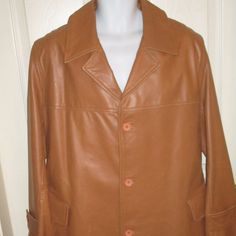 This Is A Mens Small Camel Brown Button Up Jacket By Hsa. The Chest Measures 21 Inches (Armpit To Armpit) And The Length (Collar To Bottom) Is 36 Inches. Casual Leather Outerwear With Buttons, Brown Sport Coat With Button Closure For Spring, Spring Brown Sport Coat With Button Closure, Brown Leather Button-up Jacket With Button Cuffs, Brown Button-up Leather Jacket With Button Cuffs, Collared Leather Jacket With Buttons For Business, Casual Leather Jacket With Button Closure For Business, Spring Leather Outerwear With Buttons, Brown Collared Sport Coat With Button Closure