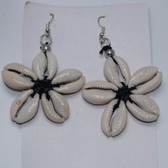 The Cowrie Shell Was Used As The First Form Of Currency In Africa. These Shells Have Been A Customer Favorite For 17 Years. These Earrings Are Fun, Playful And A Nice Accent To Any Outfit. Origin Of Beads: Kenya Bohemian Flower Earrings For Vacation, Handmade Bohemian Flower Earrings For Vacation, Handmade Flower Earrings For Beach In Summer, Summer Beach Flower Earrings, Beach Earrings With Handmade Flower Shapes, Beach Earrings With Handmade Flower Details, Handmade Flower Earrings For Beach, Handmade Flower Earrings For Vacation, Flower-shaped Earrings For Beach In Summer