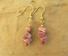 Rhodochrosite earrings gemstone earrings chip earrings pink earrings pink gemstone earrings gifts. These beautifully crafted earrings feature rhodochrosite chip beads and wooden beads on gold plated hook wires. Rhodocrosite is a popular gem with a subtle dusty pink colour. The earrings have a 4cm drop and the chip beads average 5-8mm in size. Adjustable Drop Earrings As Gift For Her, Gemstone Round Beads Jewelry Gift For Her, Adjustable Gemstone Bead Drop Earrings, Gemstone Drop Earrings As A Gift For Her, Gemstone Jewelry Gift For Her With Round Beads, Gold Gemstone Bead Drop Earrings, Gemstone Bead Drop Earrings For Gifts, Gold Drop Earrings With Gemstone Beads, Natural Stones Jewelry With Round Beads For Her