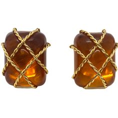 Seaman Schepps 18k gold earrings with amber from Cage collection DESIGNER: Seaman Schepps MATERIAL: 18K Gold GEMSTONE: Amber DIMENSIONS: earrings are 26mm x 20mm WEIGHT: 21.9g MARKED/TESTED: Seaman Schepps,makers mark,750,1029 CONDITION: Estate Luxury Amber Gold-plated Jewelry, Luxury Amber Gold Plated Jewelry, Luxury Amber Intaglio Jewelry, Modern Cabochon Earrings For Formal Occasions, Modern Gold Cabochon Earrings, Modern Amber Earrings For Formal Events, Modern Amber Earrings For Formal Occasions, Orange Clip-on Earrings For Formal Occasions, Formal Orange Clip-on Earrings