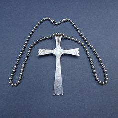 "HUGE ZUNI CROSS PENDANT with STERLING SILVER CHAIN DESCRIPTION: This impressive old Zuni cross pendant, paired with a sterling silver chain from Michele Baratta (Anglo) will be a lovely addition to your collection of fine vintage Native American jewelry. MEASUREMENTS: Pendant measures 4\" x 2 3/4\" Shepherd's hook Chain measures 24\" WEIGHT: Pendant weighs 36.7 grams Chain weighs 34.7 grams Total weight: 71.4 grams SIGNED: Cross is unsigned STERLING: Cross is unsigned, verified sterling" Spiritual Cross Necklaces For Collectors, Vintage Sterling Silver Cross Pendant Necklace, Vintage Silver Engraved Cross Necklace, Collectible Spiritual Cross Pendant Necklace, Engraved Cross Pendant Necklaces For Collectors, Vintage Engraved Silver Cross Necklace, Antique Sterling Silver Cross Pendant Necklace, Antique Silver Cross Necklace Spiritual Style, Sterling Silver Stamped Cross Jewelry