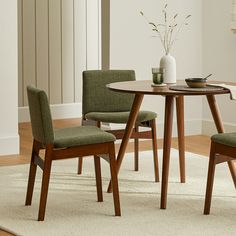 a table with two chairs and a bowl on it