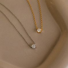 Explore modern elegance with our Hexagon Diamond Necklace, featuring a captivating rose-cut diamond at its core. This dainty and geometric piece effortlessly combines sophistication with contemporary charm, offering a unique allure for any occasion. Material: High Quality 925 Solid Sterling Silver Finish: 18K Gold ∙ Sterling Silver Featuring a ~4.5mm x 4mm Hexagonal Rose-Cut CZ Diamond Charm on a dainty Cable Chain, adjustable from 16 to 18 inches Part of our Diamond & Pavé Collection SKU: RR-NR Modern Solitaire Necklace With Diamond Cut, Modern Diamond Cut Diamond Necklace As Gift, Modern Diamond White Necklace Gift, Minimalist Solitaire Pendant Necklace With Diamond Cut, Elegant Diamond-shaped Necklace With Single Diamond, Minimalist Sterling Silver Necklace With Rose Cut Diamonds, Modern Necklace With Diamond Cut For Gifts, Modern Necklaces With Diamond Cut For Gifts, Modern Diamond Cut Necklace As A Gift