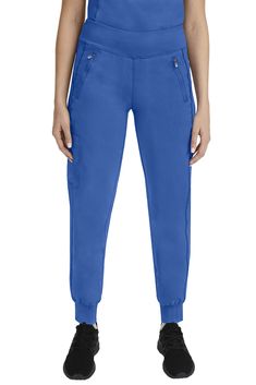 PRICES MAY VARY. CONTEMPORARY DESIGN: Our 9233 Tara Jogger Scrubs pant with 6 Pockets including 2 Zipper Pockets features a contemporary Jogger ankle style and high-performance yoga knit comfort stretch waistband. Inseam Measurements (based on size small): Regular (29), Petites (27"), Tall (31.5") THE WORLD'S BEST FABRIC: Purple Label collection for Women's Scrubs comprises a superior polyester-rayon-spandex stretch fabric blend that is lightweight, soft, and breathable. The Women Scrub Pants ar Types Of Pockets, Jogger Scrubs, Scrubs For Women, Safety Clothing, Healing Hands, Surgical Hats, Fashion Mask, Womens Scrubs, Purple Label