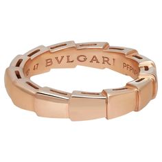 Bvlgari captures the power of seduction in this Serpenti Viper wedding band ring. Sophisticated and glamorous, this ring coils around the finger striking with the precious beauty of the scales. Crafted in lustrous 18K rose gold. Ring size: 47 US 4.25. Band width: 3.6mm. Total weight: 4.17 grams. Made in Italy. Condition: New without tags. Comes with an original box and paper. Bvlgari Wedding Ring, Power Of Seduction, Bvlgari Ring, Bvlgari Jewelry, Bvlgari Serpenti, Luxe Jewelry, Wedding Band Ring, 18k Rose Gold, Wedding Ring Bands