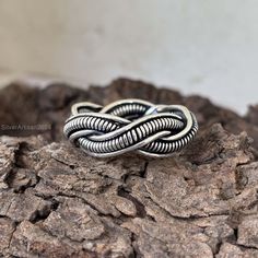 Silver Braid Ring, Braided Ring, 925 Silver Ring,Men and Women Ring,Braided Ring, Hand Braid Silver Ring,Tribal silver Ring,Thick Rope Ring  HANDMADE ITEMS * Metal: 925 Sterling Silver * Country of origin: India * Category: Rings * Assay: 925 * Size: All USA Size  * 925 sterling silver (stamped) * FAST Free Shipping Our jewelry is handmade with care using high quality materials sourced locally and internationally. We ensure durability and lasting wear and stand behind the quality of our jewelry. If you have any questions, please feel free to contact us Gift Giving Occasions #Wedding Gift #Bridesmaids Gifts #Prom Gift #Graduation Gift #First Communion Gift #Engagement Gift #Confirmation Gift #Bridal shower Gift #Birthday Gift #Bar & Bat Mitzvah Gift #Baptism Gift #Anniversary Gift #Birthday Silver Braided Ring, Silver Ring Men, Rope Ring, Rope Rings, Bat Mitzvah Gifts, Braided Ring, Thick Rope, Communion Gifts, Ring Hand