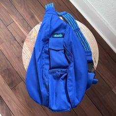 a blue backpack sitting on top of a wooden table