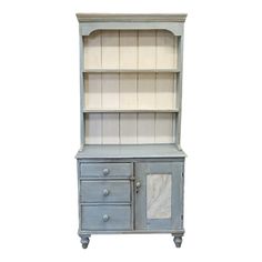 an old blue bookcase with marble top and drawers on wheels is against a white background