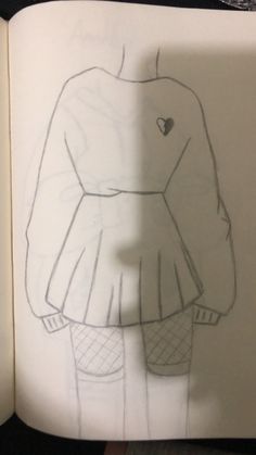 an open book with a drawing of a girl in a dress