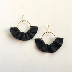 Black Statement earrings in leather, Black Leather fan earrings, Fan earrings, Statement hoop earrings, Boho fan earrings This Black fan statement earring are handmade in a hoop of brass with natural leather. The leather is gather ( pucker ) around the hoop. The result are a delicate earrings with fresh and statement look. Brass hoop 1,57 inches more 1 inches in a pleated leather skirt . The total lenght for the earrings are 3,34 inches You can choose in 6 colors ! IMPORTANT INFORMATION Process Modern Black Handmade Hoop Earrings, Modern Handmade Black Hoop Earrings, Black Leather Earrings As A Gift, Chic Handmade Black Earrings, Handmade Black Leather Earrings, Pleated Leather Skirt, Black Statement Earrings, Leather Pleated Skirt, Statement Hoop Earrings