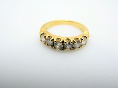 "For Sale: (1) H304 Stunning Diamond 18k Yellow Gold Wedding Band in Size 5.25 PLEASE READ ENTIRE DESCRIPTION BEFORE PURCHASING Pre-owned item. Good condition. Please see pictures for details. Sold as is, as seen on pictures. Beautiful yellow gold band with diamonds. Specifics: 18k Yellow gold Round cut diamonds Six Diamonds are approx. 0.14 ct (each) Diamonds are 0.84TCW Band Size: 5.25 Thickness: 2.4 mm wide at the bottom Thickness: 4.5 mm wide at the top Shank thickness - 1.3 mm wide Total We Elegant Ceremonial Diamond Ring, Ceremonial Gold Diamond Ring, Classic Gold Diamond Ring For Ceremonial Occasions, Elegant Gold Diamond Ring For Ceremonial Occasions, Classic Yellow Gold Jewelry For Ceremonial Wedding, Classic Hand Set Diamond Ring, Classic Hand Set Diamond Ring For Formal Occasions, Classic Hand-set Diamond Ring, Luxury Hand-set Diamond Ring For Formal Occasions