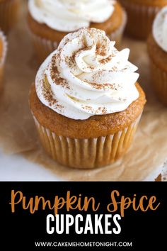 pumpkin spice cupcakes with whipped cream on top