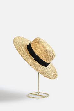 Bring classically chic flair to your summer look with the Abella Classic French Boater Hat. This classic French accessory is made from breathable straw and designed with an adjustable pull string for the perfect fit. You'll love the elegant aesthetic this piece adds to any ensemble. Head circumference: 55.5cm (designed with adjustable pull string for the perfect fit) Your purchase can also be made at: www.enbelleepoque.com Black Paper Straw Hat For Spring, Elegant Vacation Straw Hat Made Of Paper Straw, Elegant Paper Straw Hat For Vacation, Elegant Spring Panama Hat In Paper Straw, Straw Boater Hat For Spring And Summer, Elegant Spring Straw Sun Hat, Classic Woven Straw Hat For Spring, Classic Straw Hat With Short Brim For Beach Season, Classic Wide Brim Straw Hat For Beach Season