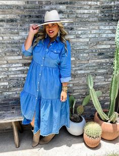 This long tiered denim dress is pure Joanna Gaines vibes! 😄 If you're all about that trendy southern charm, look no further! This adorable chambray denim dress is the ultimate canvas for your style. Throw on a belt and some boots for a chic twist, or rock it casually with your favorite sneakers. No matter how you wear it, prepare for the "Where did you get that dress?" questions! And, just so you know, this denim doesn't have stretch, but it's got oodles of style! 💁‍♀️👗👢 Sizing: ﻿This item comes in Large/Extra Large which fits a size 8-14 or a 1X which fits a size 14-18. Layered Tiered Button At Front Or The Way Maxi Dress Plus, Cheap Summer Denim Dress With Relaxed Fit, Cheap Cotton Denim Dress With Frayed Hem, Maxi Dress With Denim Jacket Plus Size Fall, Lugged Converse Dress, Affordable Long Sleeve Denim Dress For Summer, Cheap Long Sleeve Denim Dress For Fall, What To Wear Under Wrangler Retro Denim Dress, Baby Shower Attire For Guests Jeans