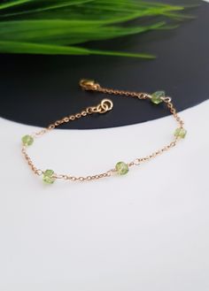 Gold Peridot Bracelet, Peridot Bracelet for Women, Peridot Birthstone Jewelry, August Birthstone Bracelet, Dainty Gold Bracelet Gift For her This is a delicate natural raw Peridot bracelet  All of our jewelry is handmade and every stone is handpicked for the best quality. the color and size of each stone are natural, unique, and individual. Our Elegant Green peridot bracelet is great for a bridesmaid gift, Birthday gift, Bridal Gift, Christmas gift... Each bracelet will be packed in beautiful gi Green Birthstone Round Bead Jewelry, Adjustable Elegant Lime Green Jewelry, Green Dainty Bracelets With Natural Stones, Dainty Green Bracelets With Natural Stones, Green Round Chain Bracelet Gift, May Birthstone Crystal Gemstone Bracelet, Dainty Green Bracelet With Natural Stones, Dainty Green Gold Bracelet Gift, Dainty Green Peridot Jewelry