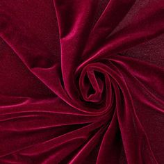 a close up shot of a red velvet fabric