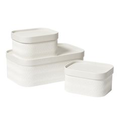 three white containers are stacked on top of each other