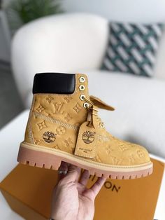 Elevate your style and conquer any terrain with these Timberland-inspired boots, reimagined with the iconic Louis Vuitton monogram. Crafted with premium leather and meticulous attention to detail, these boots offer a unique blend of rugged functionality and high-fashion flair. Step out in confidence and express your individuality with this statement-making footwear. Luxury Ankle Lace-up Boots With Lug Sole, Luxury Lace-up Ankle Boots With Lug Sole, Luxury Ankle Moto Boots With Lug Sole, Luxury High-top Lace-up Boots, Luxury Moto Boots With Lug Sole, Luxury Lace-up Boots With Lug Sole, Luxury Lace-up Ankle Boots With Reinforced Heel, Luxury Moto Boots With Reinforced Heel, Luxury Winter Boots With Round Toe