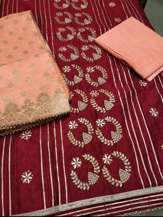 Item Overview ATHARVA Hand Embroidered Indian Salwar Kameez w/Panel Embroidery in Maroon & Banarsi Silk Dupatta/Customized Stitching/Wedding/Punjabi/ Dno. CH1632 Fabric: * Shirt: Chanderi Silk - Maroon - 2.5Mts - Embroidered Panel * Dupatta: Banarsi Silk Dupatta in Orange (Motifs may wary) * Salwar: Santoon Silk 2.5 Mts. Excusive Hand Embroidered Party Wear Punjabi Suit. Customization: * Fabrics: Designs Can be made in different Fabrics. * Stitching Available Care: * Dry Clean/ Avoid direct Iron Semi-stitched Raw Silk Kurta With Dabka Work, Semi-stitched Jamawar Sharara With Gota Work, Semi-stitched Raw Silk Set With Gota Work, Diwali Unstitched Jamawar Suit With Gota Work, Eid Chanderi Unstitched Suit With Gota Work, Unstitched Jamawar Salwar Kameez With Gota Work, Semi-stitched Chandbali Salwar Kameez For Traditional Ceremonies, Eid Gota Work Chanderi Unstitched Suit, Festive Chinon Unstitched Suit