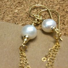 These fresh water pearl earrings created by Jewelry by CARMAL are made of: Freshwater pearl gemstones, Gold filled: chain, spacers, beads, ear wires and findings. These earrings measure 2 inches in length. View more dangle earrings: http://www.etsy.com/shop/cdjali?section_id=8002052 All of our jewelry is unique and custom designed. Most of our jewelry can easily be resized. If there is a piece of jewelry that you are interested in, but would like some changes made, please do not hesitate to cont June Birthstone Jewelry, Earrings Pearl, Fresh Water Pearl, June Birthstone, Pearl Gemstone, Bride Jewellery, June Birth Stone, Jewelry Gold, Bride Wedding