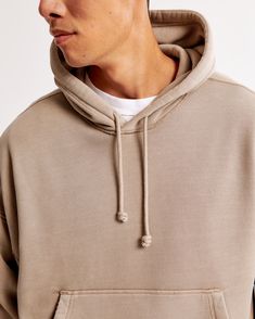 Elevate your casual wardrobe with the Men's Essential Cropped Popover Hoodie from Abercrombie & Fitch. This stylish piece is not just a hoodie; it's a statement of comfort and fashion.

- **Size**: Medium
- **Color**: Light Brown
- **Material**: Cotton, Polyester blend
- **Gender**: Male
- **Features**: Oversized, cropped fit; softAF fabric; exterior drawcords; front pouch pocket; banded hem and cuffs

Crafted in a unique oversized and cropped silhouette, this hoodie is made from our exclusive s Drop Shoulder Hoodie, Brown Hoodie, Hoodie Pattern, Vintage Silhouette, Men's Tops, Abercrombie Kids, Oversized Hoodie, Mens Essentials, Workout Hoodie