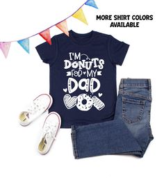 "\"I'm Donuts for Dad\" - this adorable donuts design is perfect for your little cutie that can't get enough of his or her Dad. Makes an awesome every tee as well! ♥Every tee is made with Love♥ This design is printed using ink. We print our designs on Unisex kids shirts. For the boys, they can run true to size or smaller. And for the girls' they do run larger. Of course, this is dependent on the build of the child as fit will always vary. We always suggest checking out the size chart for measure Fun Tops With Funny Print For Father's Day, Fun Black Top With Funny Print For Father's Day, Cute Crew Neck Shirt For Father's Day, Cute Father's Day Shirt With Crew Neck, Donuts For Dad, Donuts Design, Donut Shirt, Fathers Day Shirts, Dad To Be Shirts