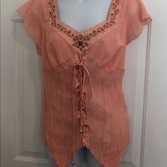 Peach Colored Very Unique Top With Lace Up Detail Down The Front Feminine Embellished Summer Tops, Embellished Feminine Summer Tops, Fitted Embellished Tops For Beach, Elegant Embellished Tops For The Beach, Elegant Embellished Top For Beach, Fitted Embellished Blouse, Casual Fitted Embellished Blouse, Unique Top, Pretty Blouses