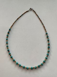 This beautiful Navajo Turquoise and Heishi Beaded Necklace adds a touch of western charm to any outfit. The stunning combination of turquoise and heishi beads creates a gorgeous, chic look that is sure to make a statement. Elevate your style with this unique and eye-catching necklace! Turquoise & Heishi Beaded Necklace 16" Long Navajo Beads are natural and may vary Horse Hair Pottery, Necklaces Style, Heishi Necklace, Navajo Turquoise, Stone Feature, Necklace Turquoise, Western Wedding, Heishi Beads, Beaded Material