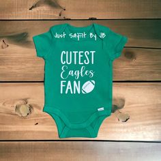 Cutest Eagles Fan with a customized back is perfect for you little one! Each bodysuit is available in short sleeve and 0-3 months ONLY. Each baby bodysuit is made with commercial grade iron on white vinyl. Baby bodysuit is made by Gerber. **Colors may vary from screen to screen from actual product** NOTE: Due to the post office (USPS) delays, I cannot guarantee shipment at a specific delivery date. Bodysuits are shipped via USPS First Class Shipping. If you would like your order to arrive faster Eagles Game Day, Eagles Game, Big Sister Gifts, Eagles Fans, Eagles Football, Football Baby, Baby Brother, Iron On Vinyl, White Vinyl