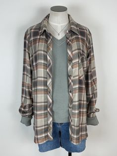 Indulge in comfort and style with the Kendall Plaid Button Down in Multi. This soft and cozy flannel features a button-down design and front chest pocket, making it cute and practical. Perfect for any occasion, it's the ultimate blend of comfort and fashion - you won't want to take it off! Length: 27.5" 100% Rayon Brand: Be Cool Collared Shirt For Loungewear In Fall, Collared Shirt For Fall Loungewear, Relaxed Fit Shirt For Loungewear In Fall, Casual Fall Shirt With Buttoned Pockets, Relaxed Fit Shirt For Fall Loungewear, Everyday Brown Button-up Flannel Shirt, Everyday Plaid Flannel Shirt With Pockets, Brown Button-up Flannel Shirt For Everyday, Casual Loungewear Shirt With Button Closure