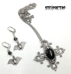 "This fantastic silver plated filigree cross necklace features a Swarovski black jet crystal and is part of our new Dark Gothic range, and is a step away from our previous steampunk work.The set comes complete with our spooky silver plated vampire bat earrings! There are numerous Gothic designers out there, and various marketplaces to purchase Gothic jewellery, but i am sure you will like what we are doing here Growing up in the 80's i lived through the \"goth\" movement, many a lost weekend was Silver Cross Jewelry For Halloween, Gothic Cross Pendant Jewelry For Halloween, Black Cross Pendant Jewelry For Halloween, Black Cross Jewelry For Halloween, Silver Gothic Jewelry For Jewelry Making, Gothic Black Metal Cross Necklace, Black Steampunk Jewelry For Halloween, Silver Cross Pendant Jewelry For Halloween, Silver Ankh Gothic Necklace